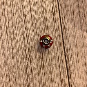 Red and white Pandora charm